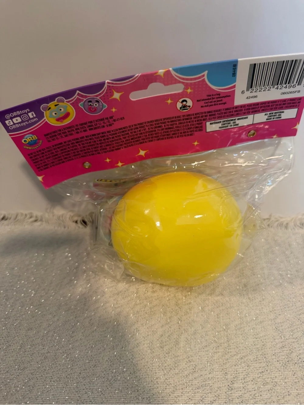 Orb Smushers Yellow Emoji Squishy Toy with Blue Glasses and Pink Tongue